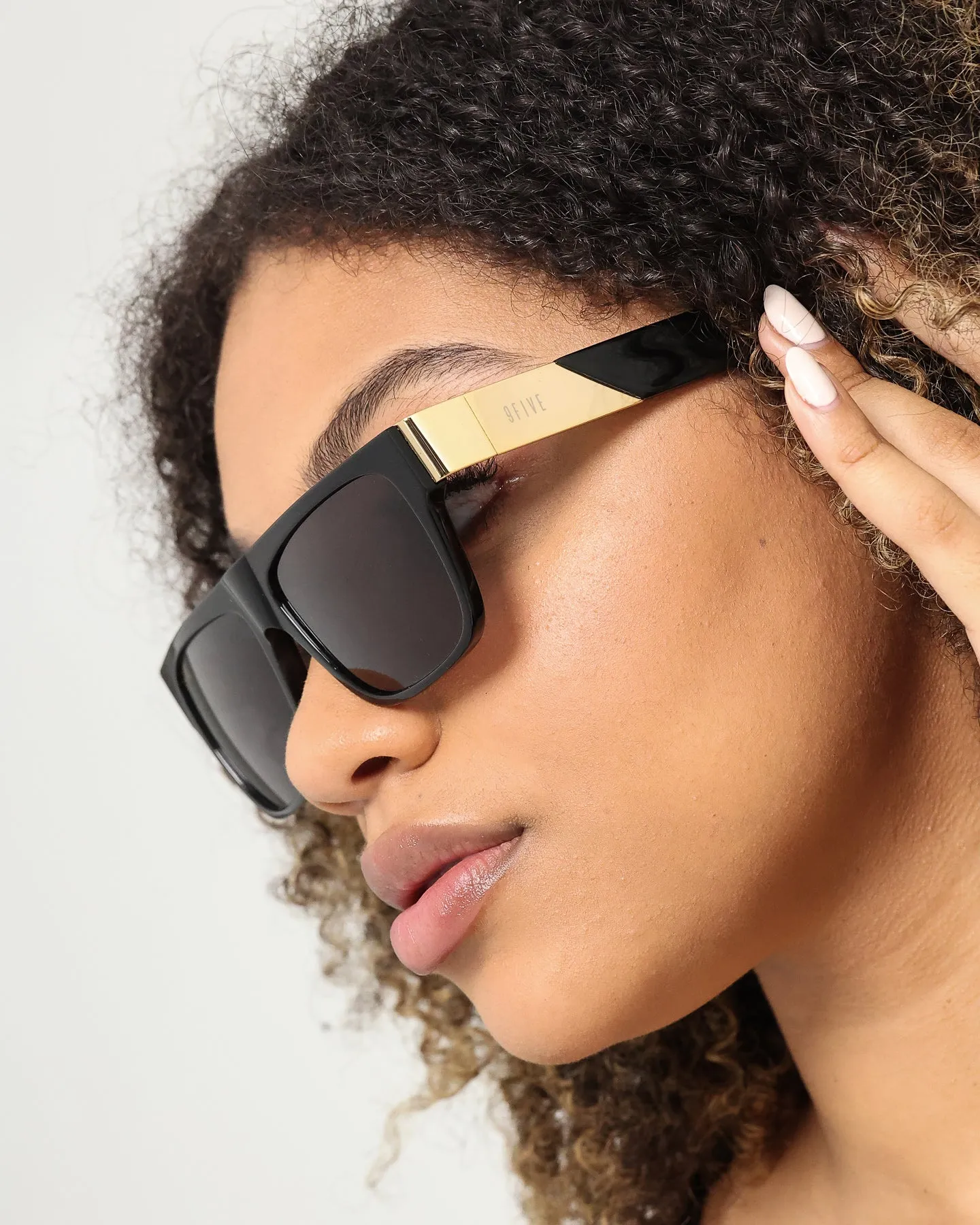 Elegant Black Sunglasses with Gold Accents